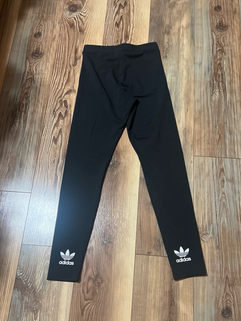 Adidas Black women’s Leggings with White logo accents